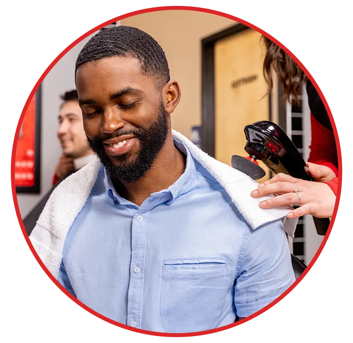 Man receiving a neck and shoulder treatment